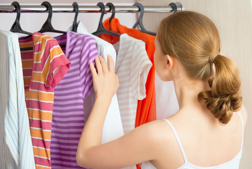 Woman examining what to wear. 